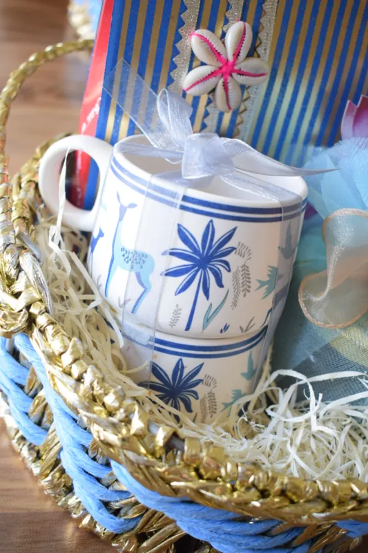 Blue and gold Diwali gift basket with ceramic accents